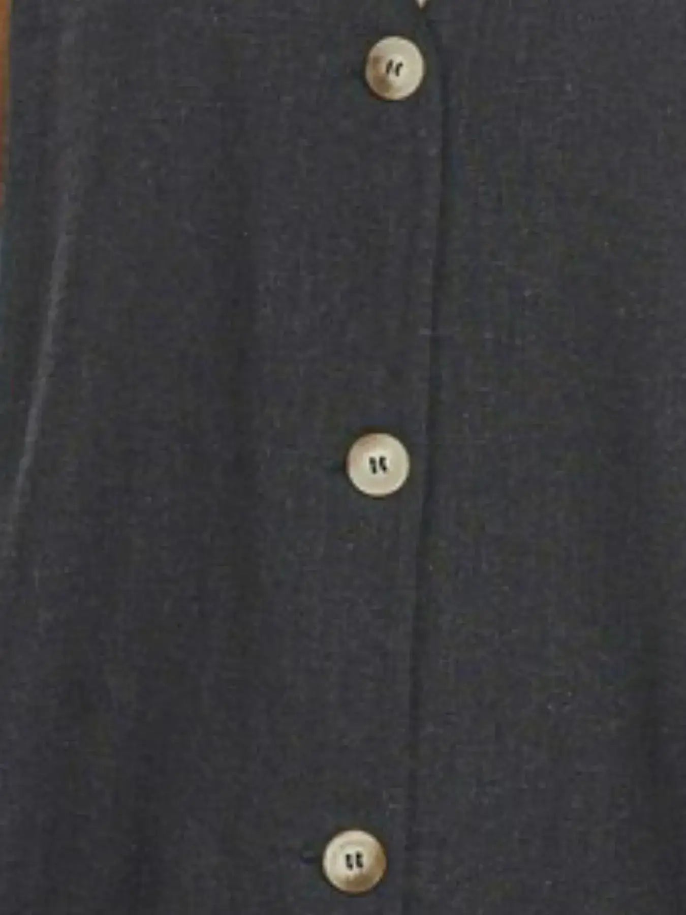 Navy blue slit button-front vest with white buttons and classic collar design