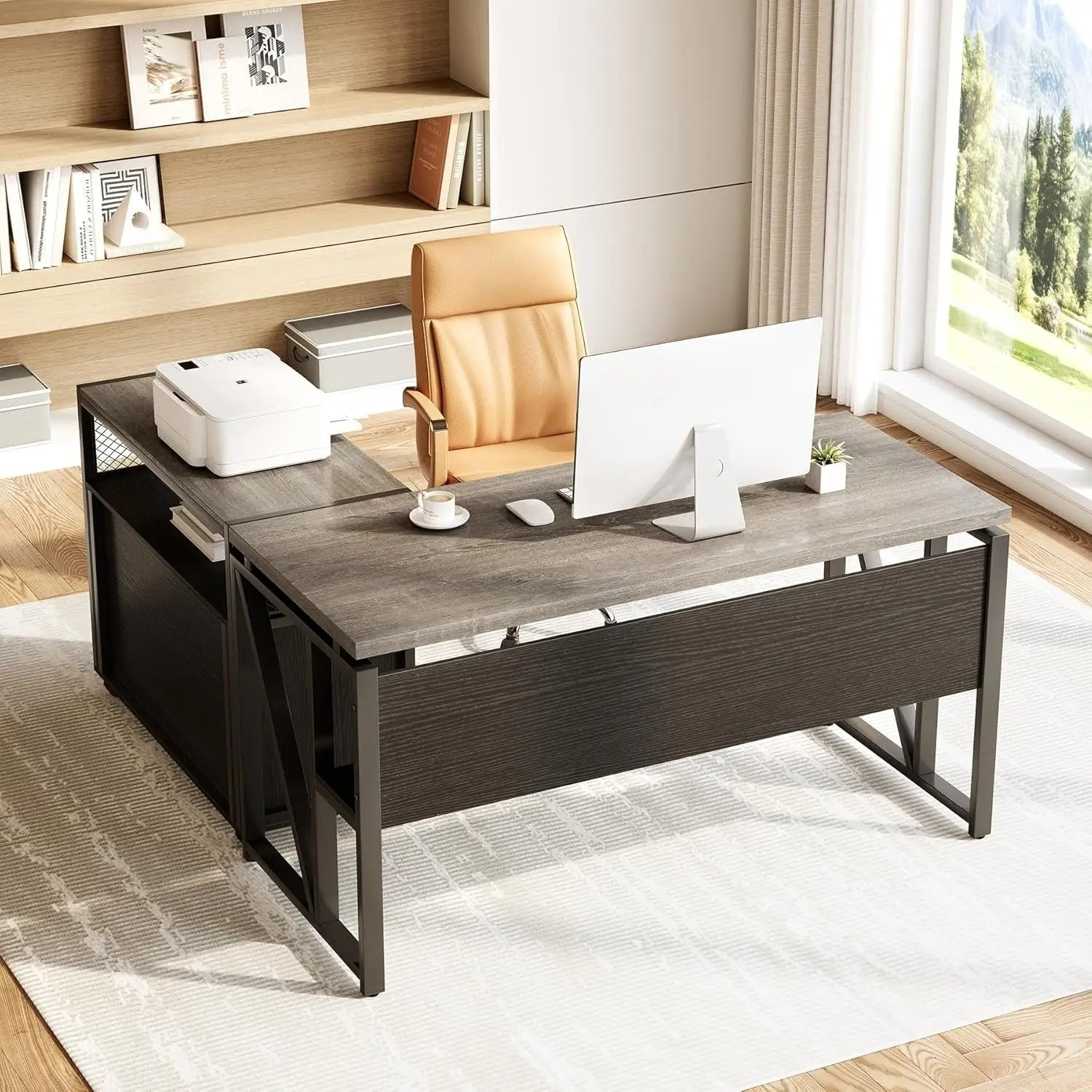 Modern dark gray office desk with metal legs and a sleek design, featuring an integrated storage unit.