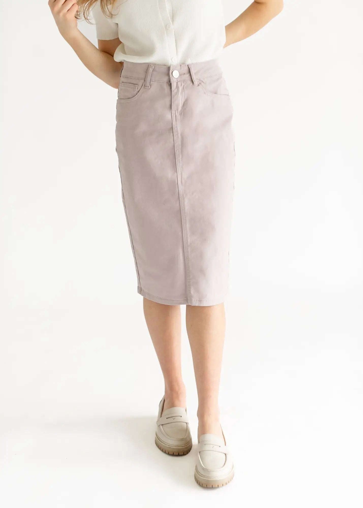 Lavender denim pencil skirt with button closure and high waistband.