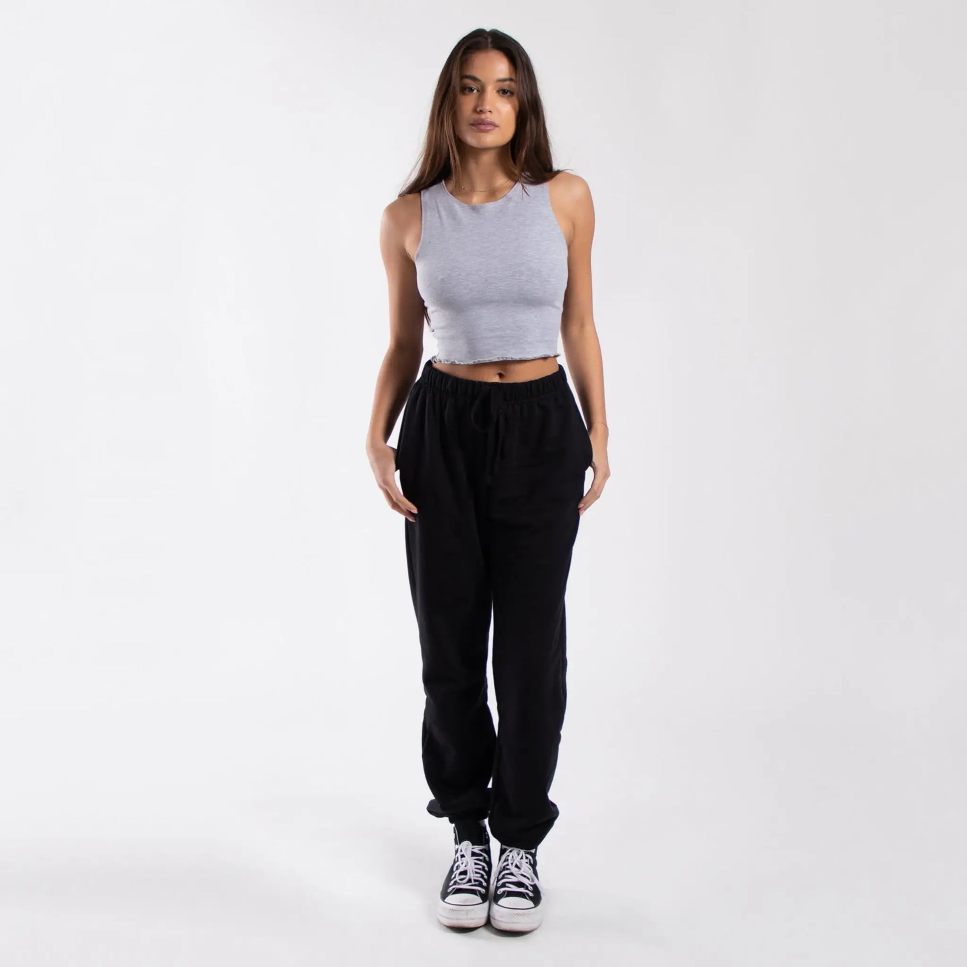 Lavender lettuce trim muscle tank with black jogger pants and white sneakers - info otlapparel