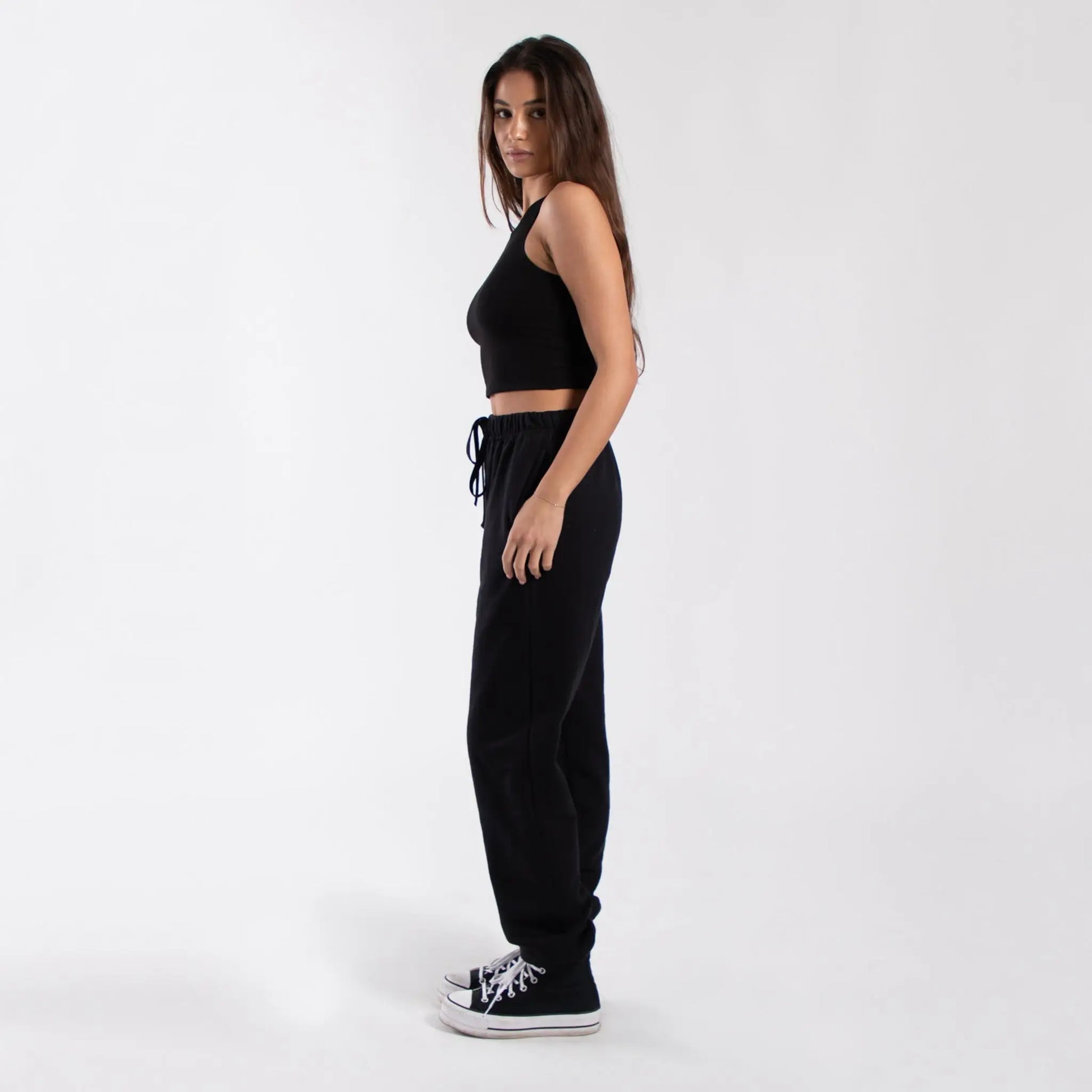 Black drawstring jogger pants with white stitching and relaxed fit from info otlapparel