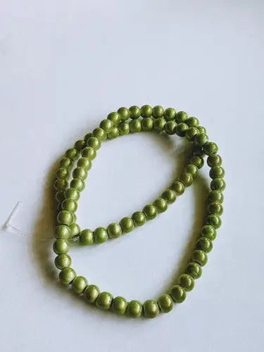 Olive green round glass beads with original gloss from 1 Strand Wonder Bead Medium Green Peridot