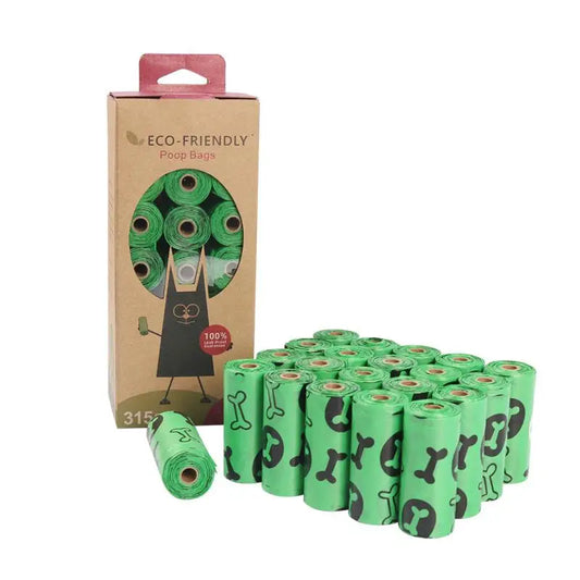 Bulk green bone-printed dog poop bags in rolls with dispenser box for pet waste cleanup