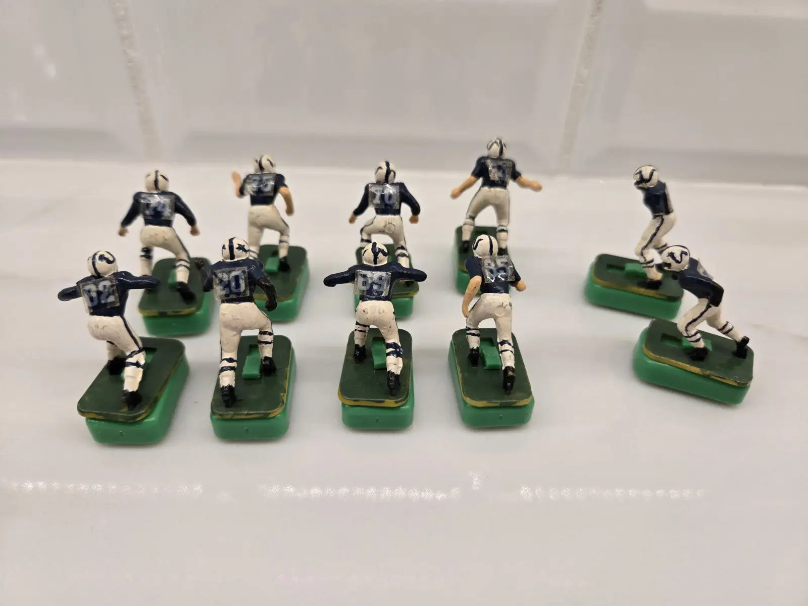 Electric football figures from Indianapolis Colts Electronic gameplay, two damaged players