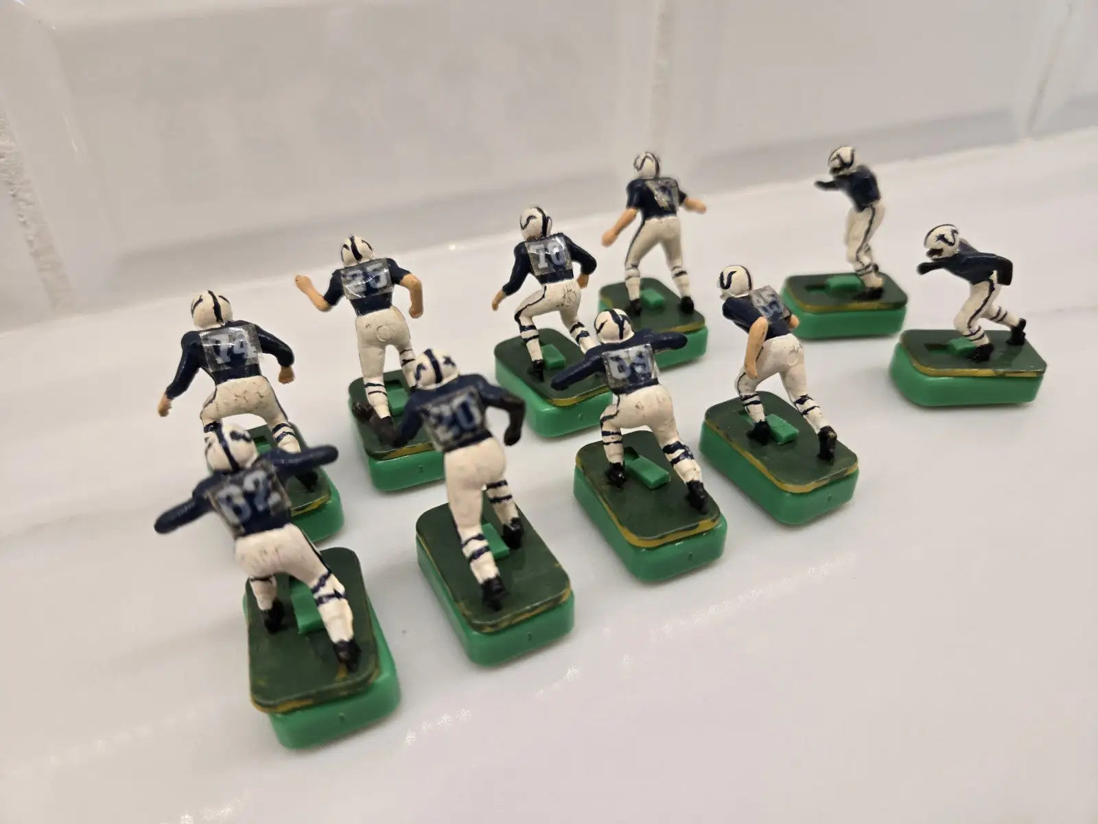 Vintage Indianapolis Colts electronic football figures in damaged Tudor product display