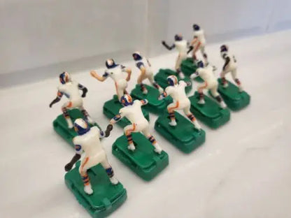 Vintage Denver Broncos electronic football figures in white uniforms with stands