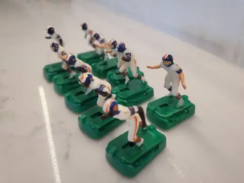 Vintage Denver Broncos electronic football game figurines in white uniforms