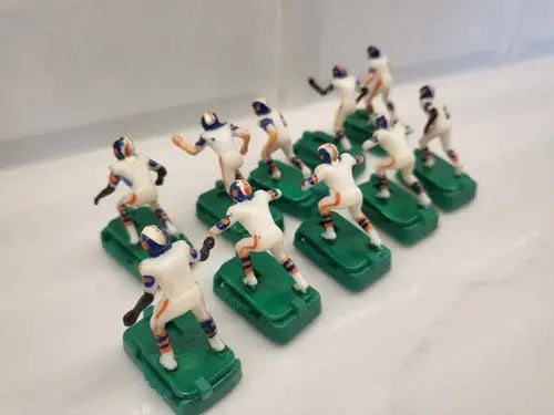 Vintage Denver Broncos electronic football game figures with stands in white uniforms