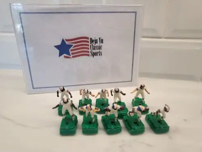 Miniature Denver Broncos electronic football figures in white uniforms with stands
