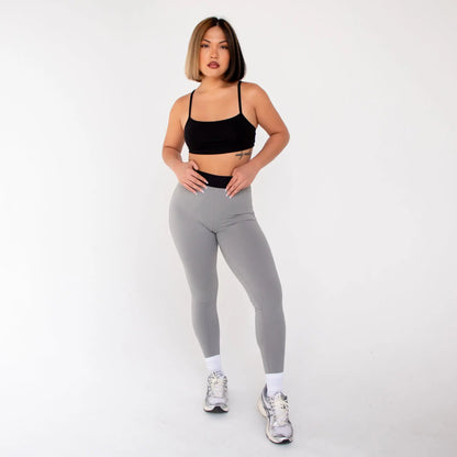 Grey leggings with black waistband and white sneakers from 1000BD Womens Banded Pro Legging info otlapparel