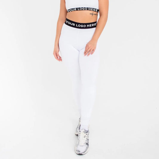 White leggings with black waistband and logo design from 1000BD Women’s Banded Pro Legging, info otlapparel