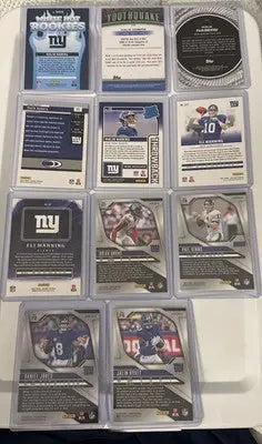 Collection of New York Giants football cards featuring Malik Nabers, Simms, Manning, and Jones