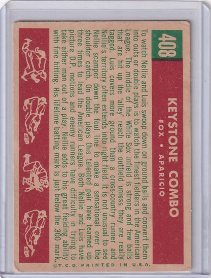 Vintage Topps Baseball Card featuring Nellie Fox and Luis Aparicio on a red and green background