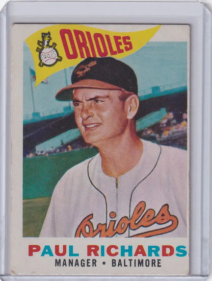 Baseball card of Paul Richards in Baltimore Orioles uniform, smiling proudly