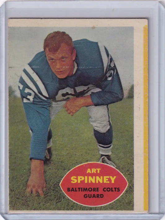 Vintage Topps Football trading card of Art Spinney in three-point stance for Baltimore Colts