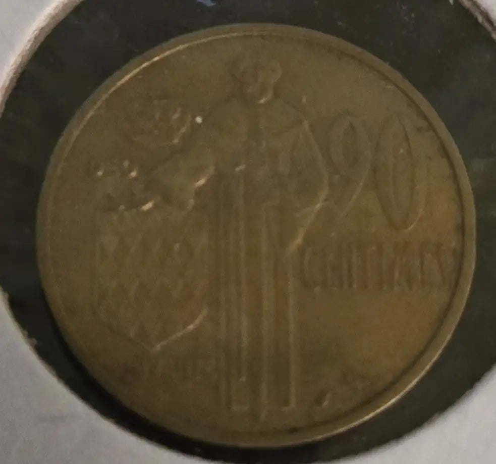 Bronze-colored coin with standing figure and 20 CENTIMAS inscription from Monaco 1962