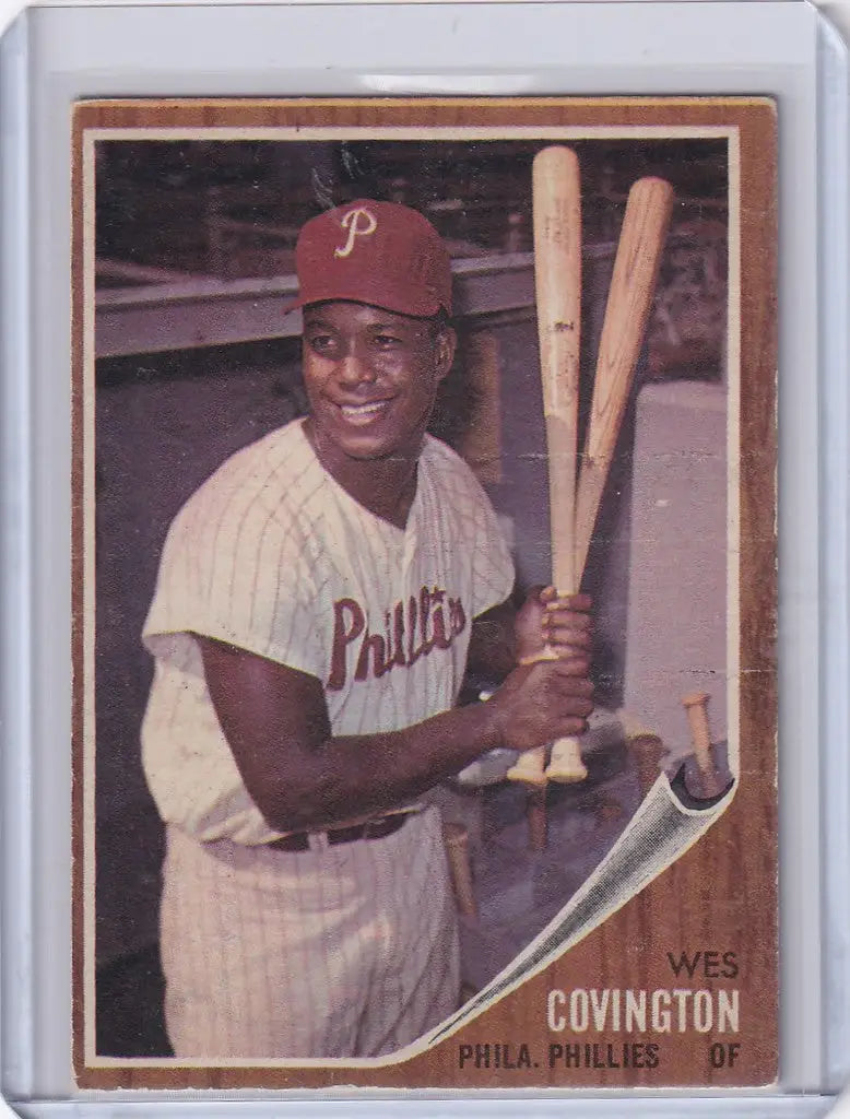 Wes Covington baseball card displaying smiling Philadelphia Phillies player with bats