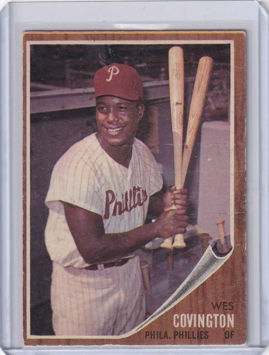 Wes Covington baseball card displaying smiling Philadelphia Phillies player with bats