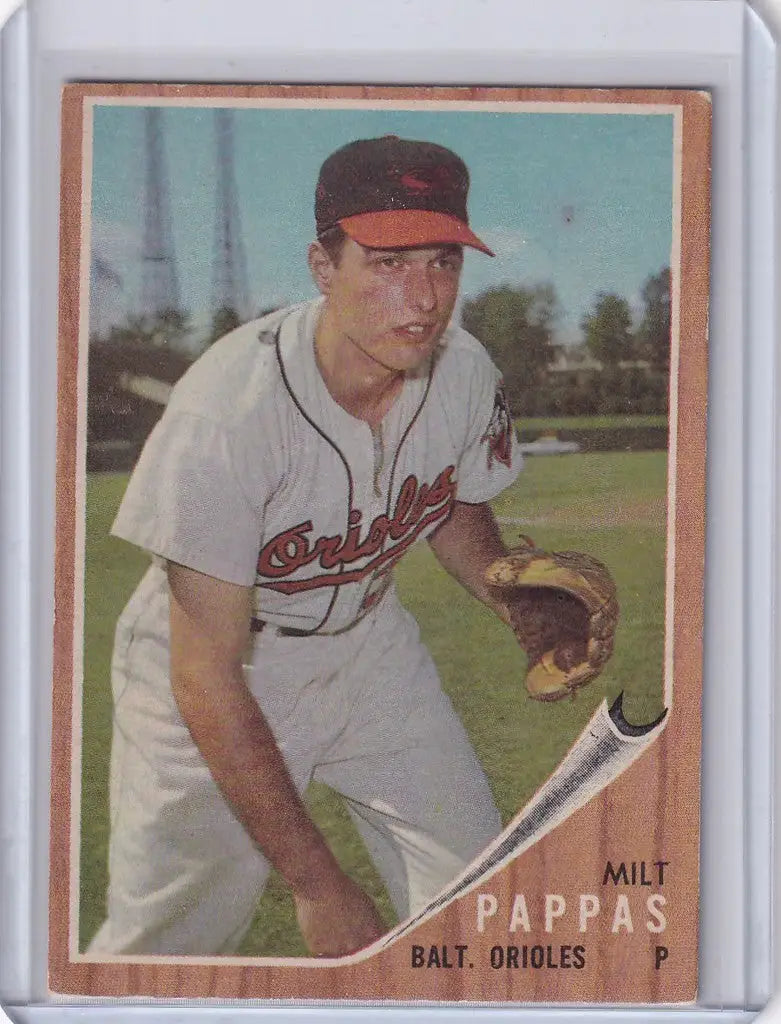 1962 Topps #75 Milt Pappas trading card showcasing Baltimore Orioles pitcher with bat and glove