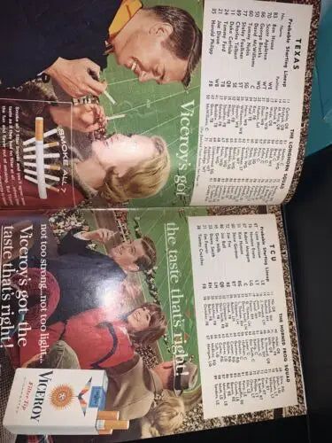 Vintage magazine advertisement featuring Texas Longhorns and Darrell Royal’s autograph