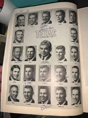Autographed Texas yearbook page featuring Darrell Royal and Texas Longhorns memorabilia