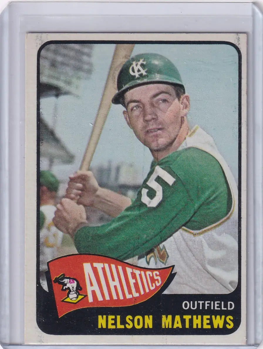 Vintage Topps Baseball card of Nelson Mathews, Kansas City Athletics outfielder with bat