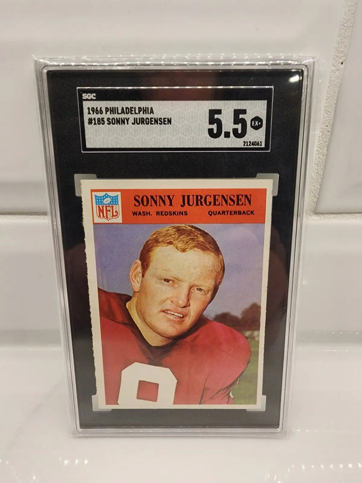 Graded Sonny Jurgensen football card from 1966 Philadelphia football series featuring Washington Commanders