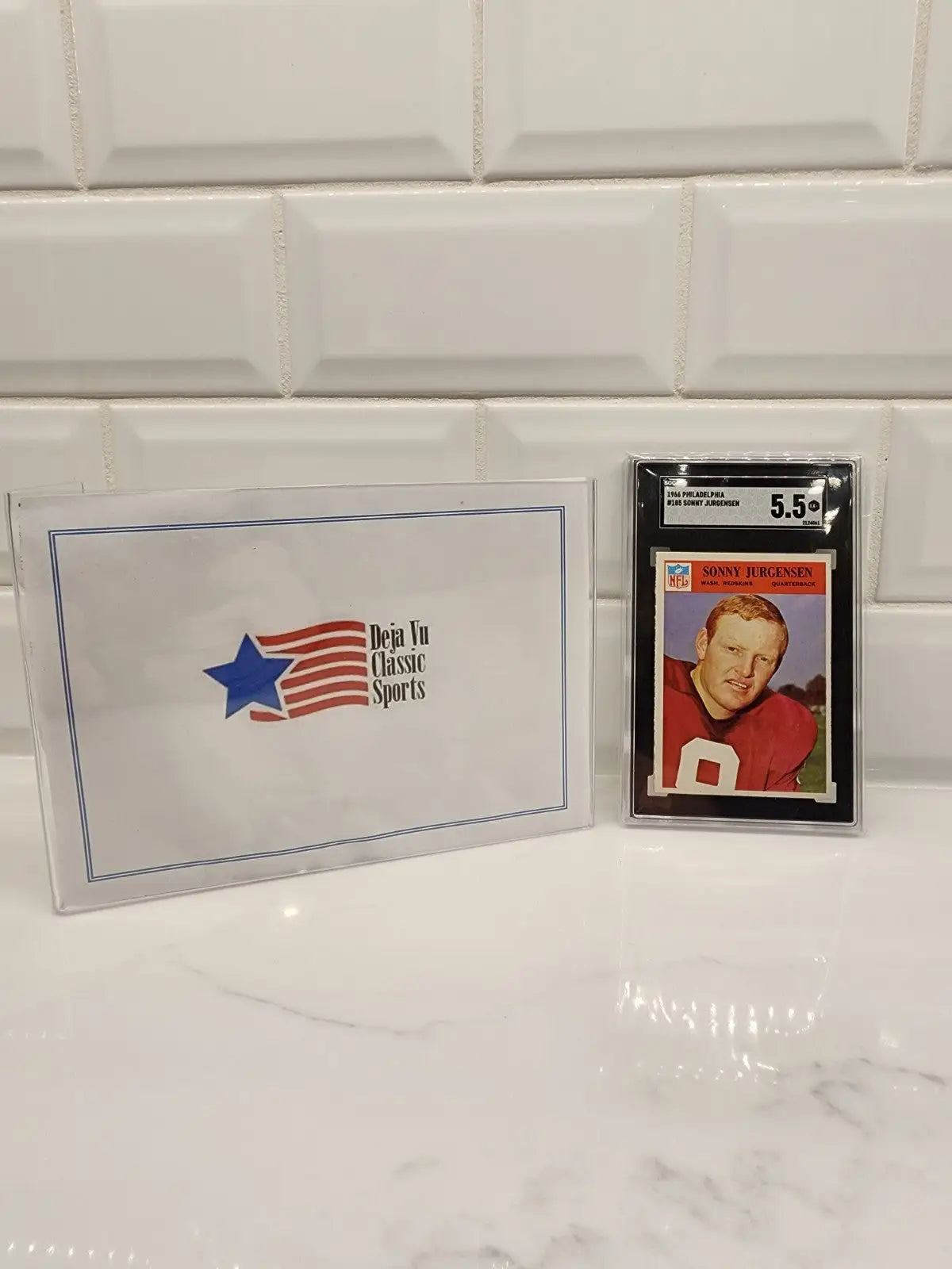 Graded Sonny Jurgensen Philadelphia football trading card from 1966 displayed in product
