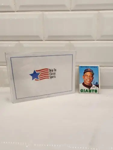 Vintage baseball trading card of Willie Mays in protective case from 1967 Topps