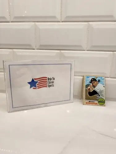 1968 Topps Brooks Robinson trading card in protective case for collectors