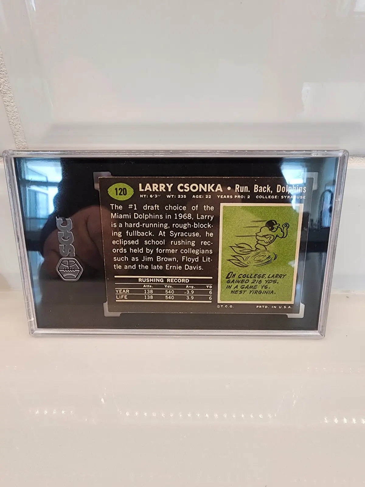 Larry Csonka football trading card from 1969 Topps #120 Csonka RC SGC 7