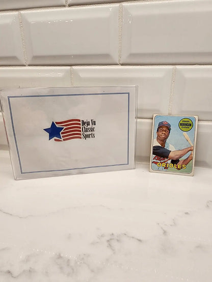 Baseball cards and sports memorabilia box featuring 1969 Topps Frank Robinson trading card