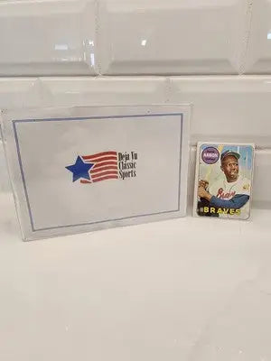 Baseball card and memorabilia box featuring 1969 Topps Hank Aaron #100 EX-NM