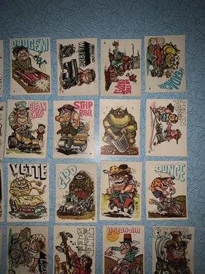 Collection of cartoon trading cards from Donruss Odder Odd Rods series featuring colorful stickers