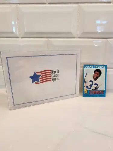 Dallas Cowboys Duane Thomas trading card and box from 1971 Topps #65 NM-MT