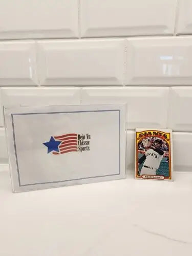 Baseball trading card of Willie McCovey in protective case from 1972 Topps San Francisco Giants