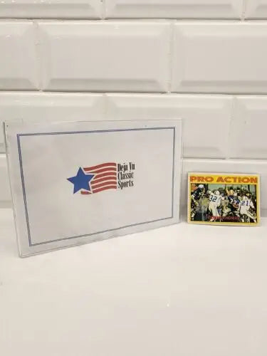 Sports memorabilia featuring Duane Thomas Topps Pro Action 1972 card in excellent condition