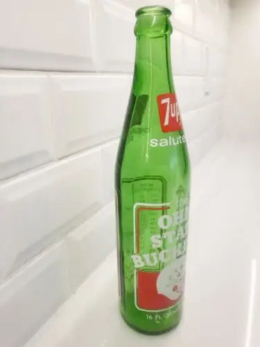 Green glass 7-Up bottle commemorating Ohio State Buckeyes 1973 national championship