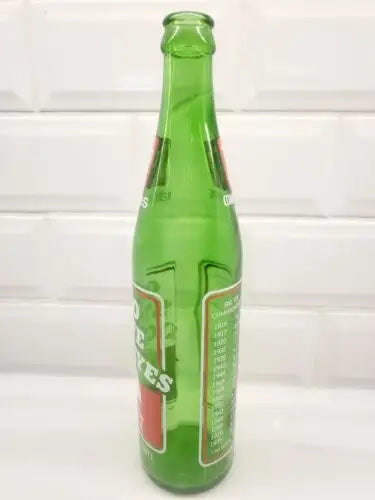 Green glass soda bottle for Ohio State Buckeyes 1973 7UP commemorative drink