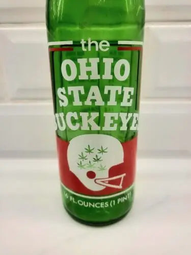 Green glass Ohio State Buckeyes design on 1973 7UP commemorative bottle