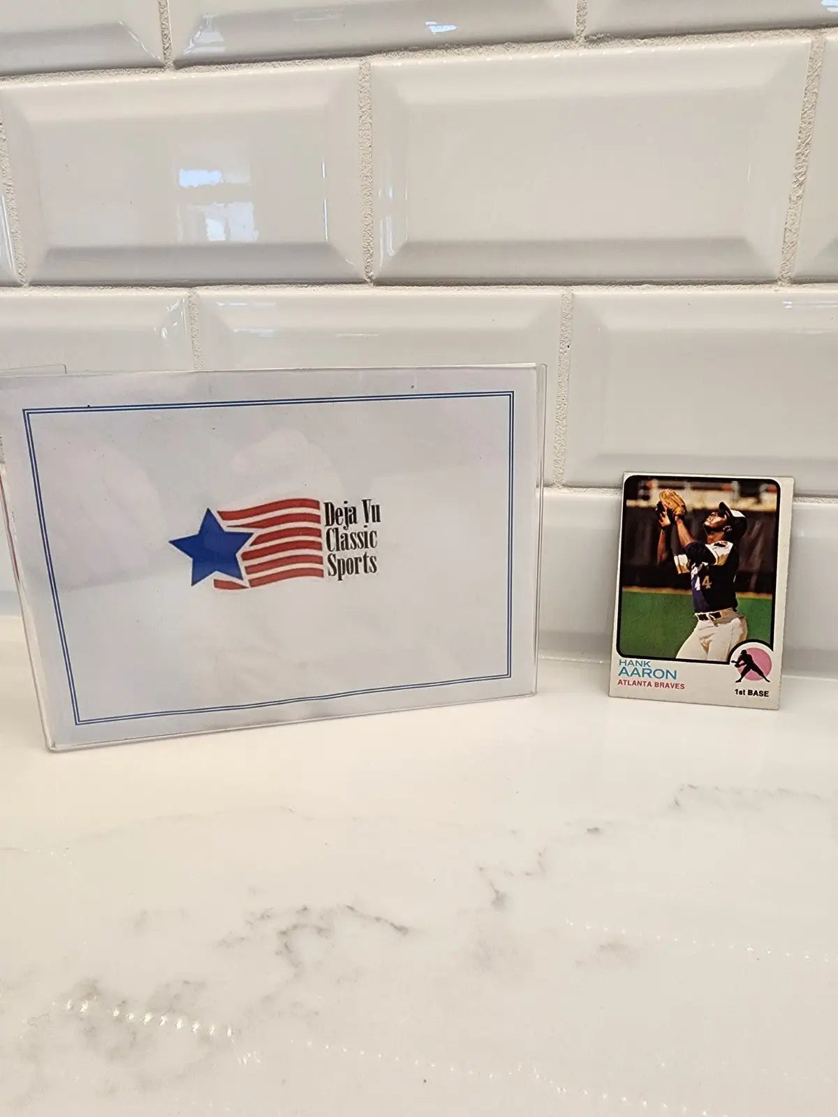 Hank Aaron trading card in protective case from 1973 Topps #100 collectible card