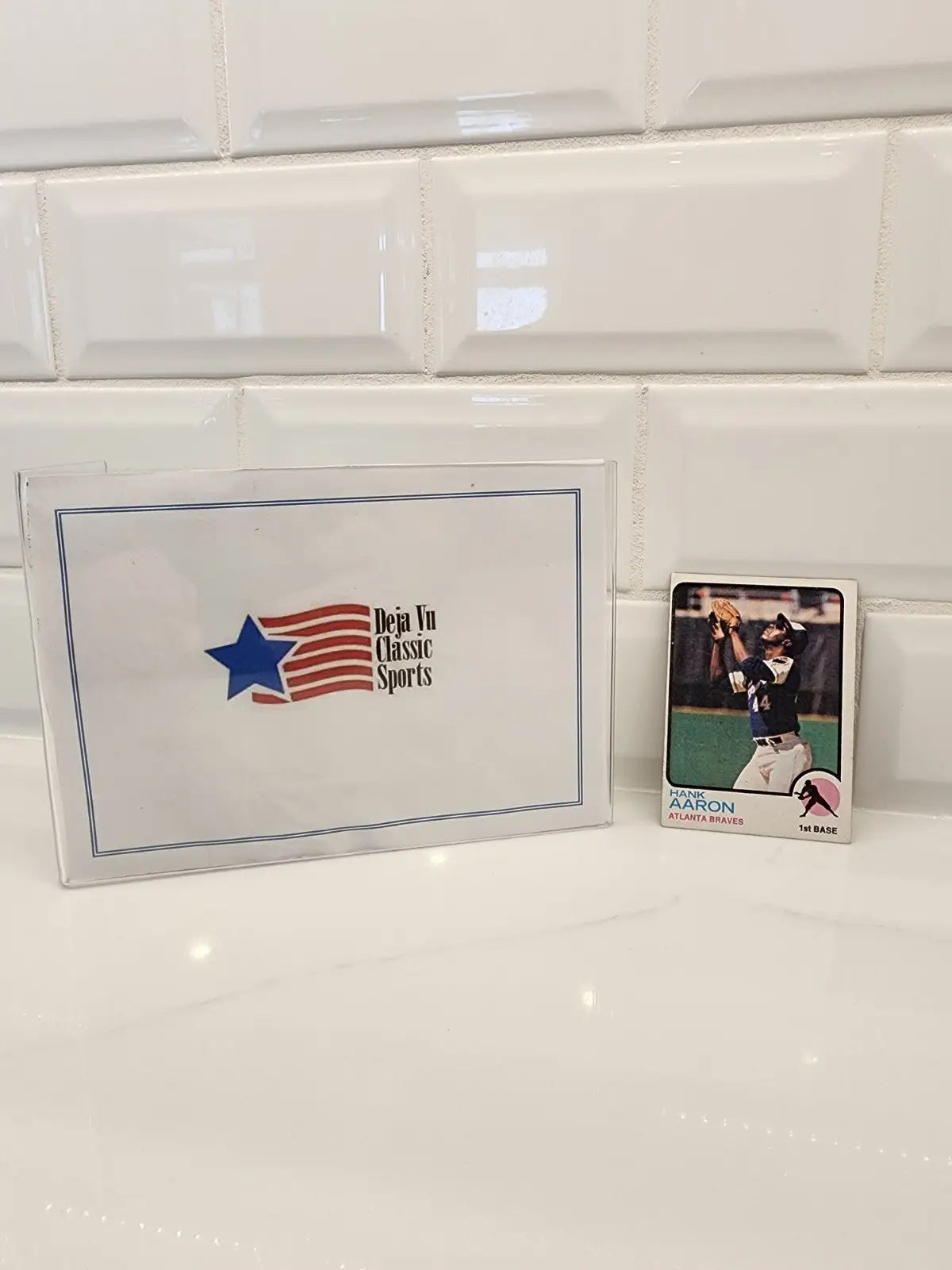 Hank Aaron trading card from 1973 Topps with Deja Vu Classic Sports envelope