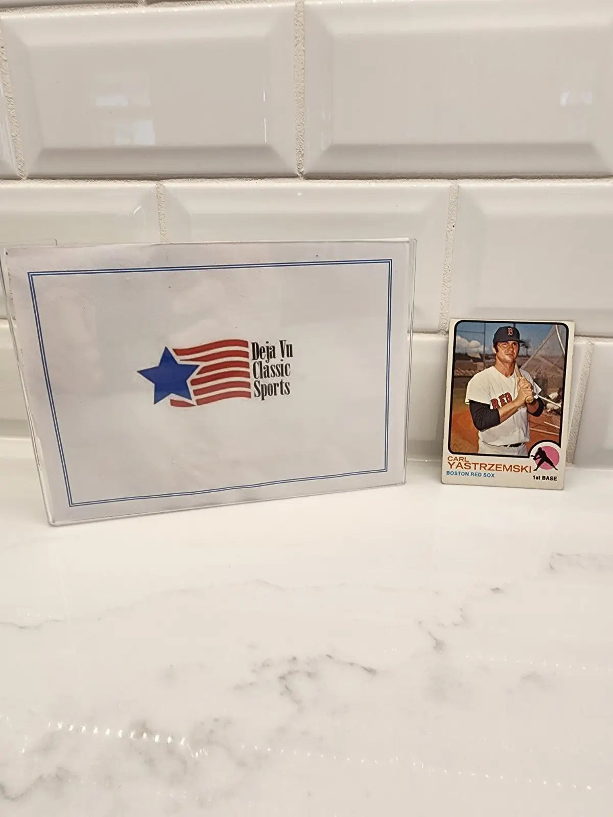 Baseball trading card of Carl Yastrzemski in protective sleeve, Boston Red Sox player