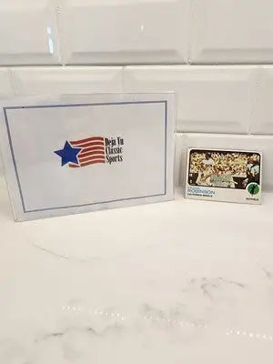 Sports memorabilia featuring 1973 Topps Frank Robinson card in excellent condition