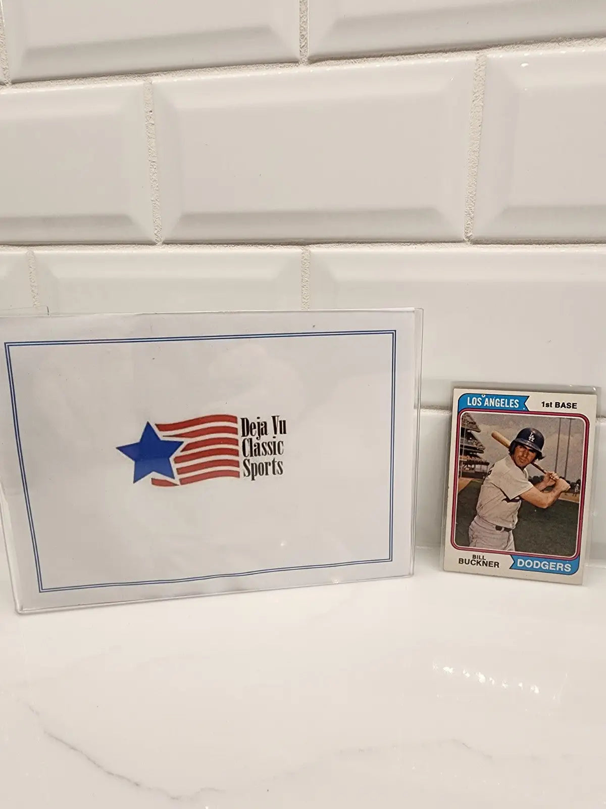 Vintage sports trading card of Bill Buckner in protective sleeve from 1974 Topps series