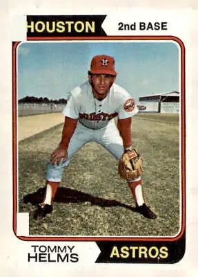 Tommy Helms baseball card from 1974 Topps series featuring Tommy Helms on the front