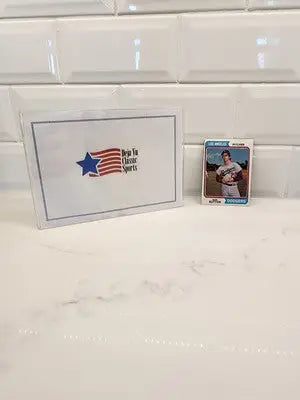 Baseball card of Don Sutton in protective case from 1974 Topps Don Sutton series