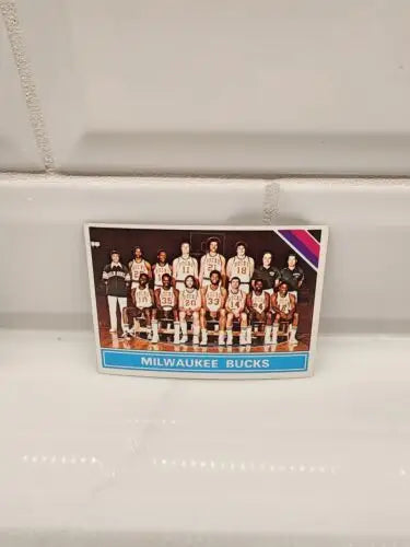 Milwaukee Bucks basketball trading card from 1975-76 Topps Checklist #213 EX