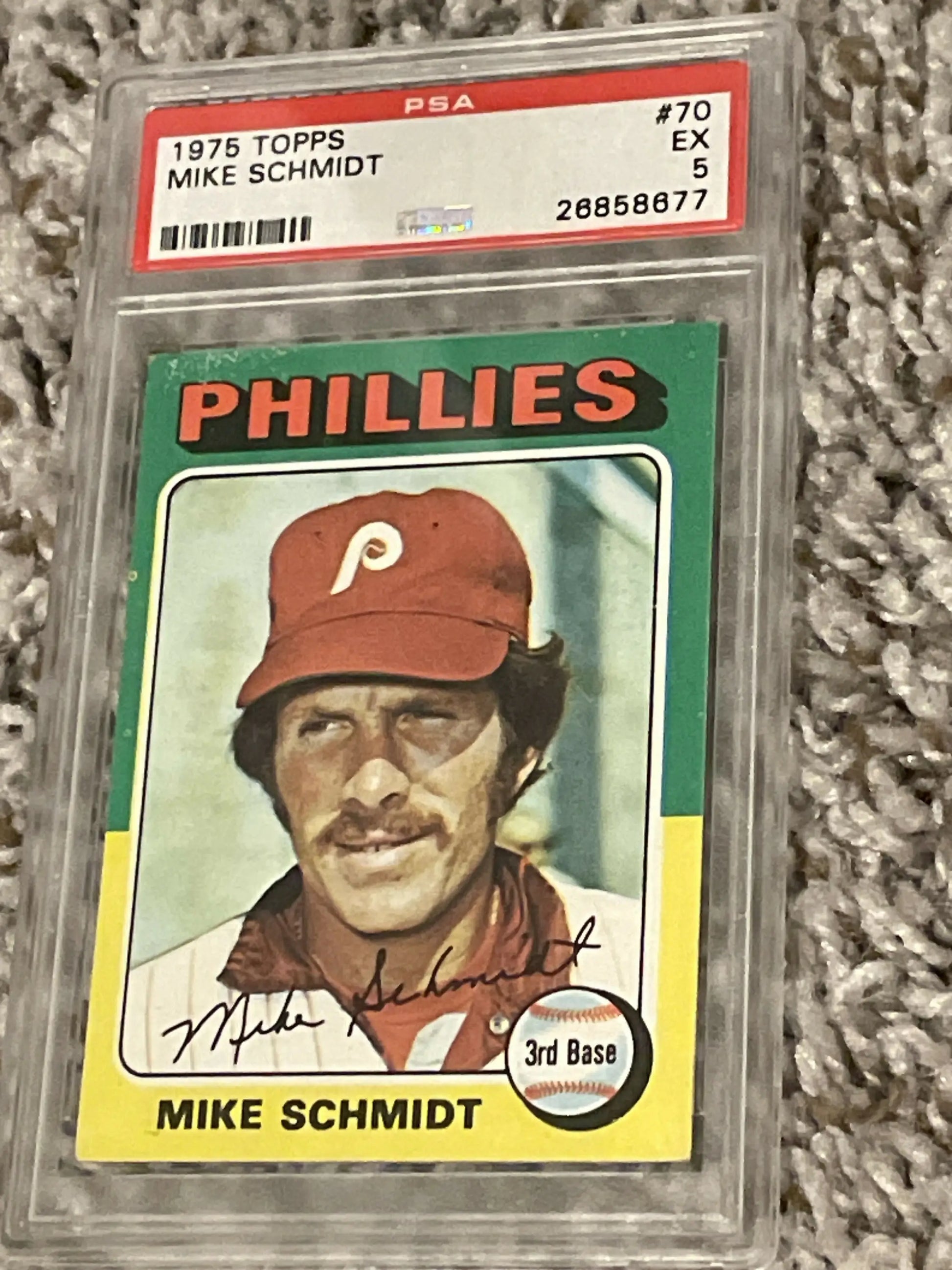 Graded Mike Schmidt baseball card from 1975 Topps set in protective case