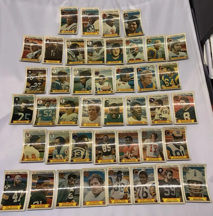 Vintage NFL football stars trading cards from the 1980 Stop N Go 3-D partial card set